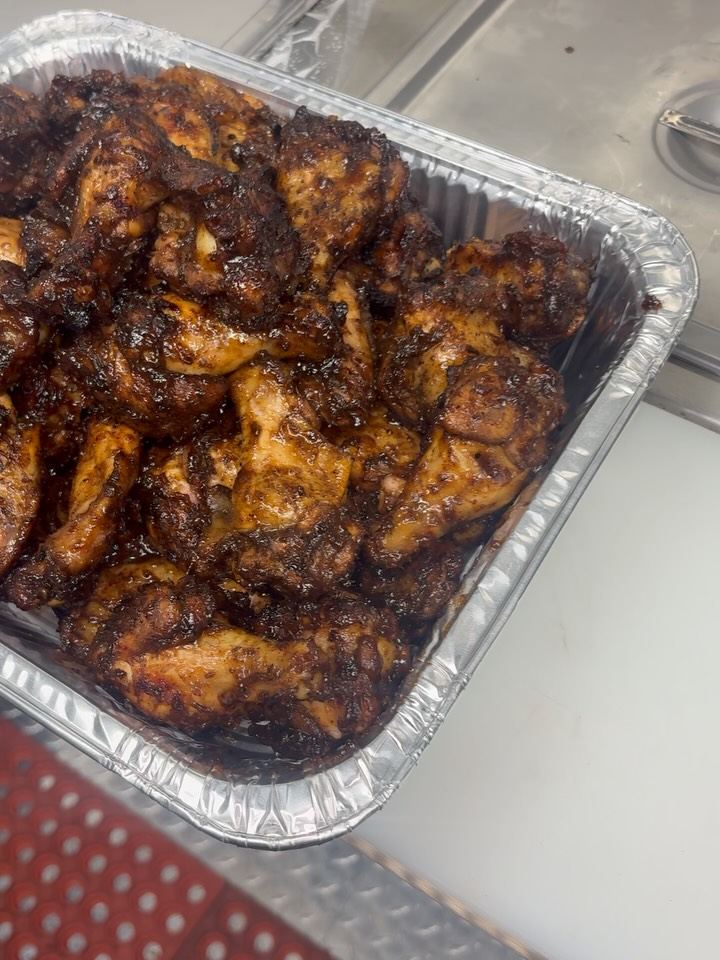 Foil tray of jerk chicken