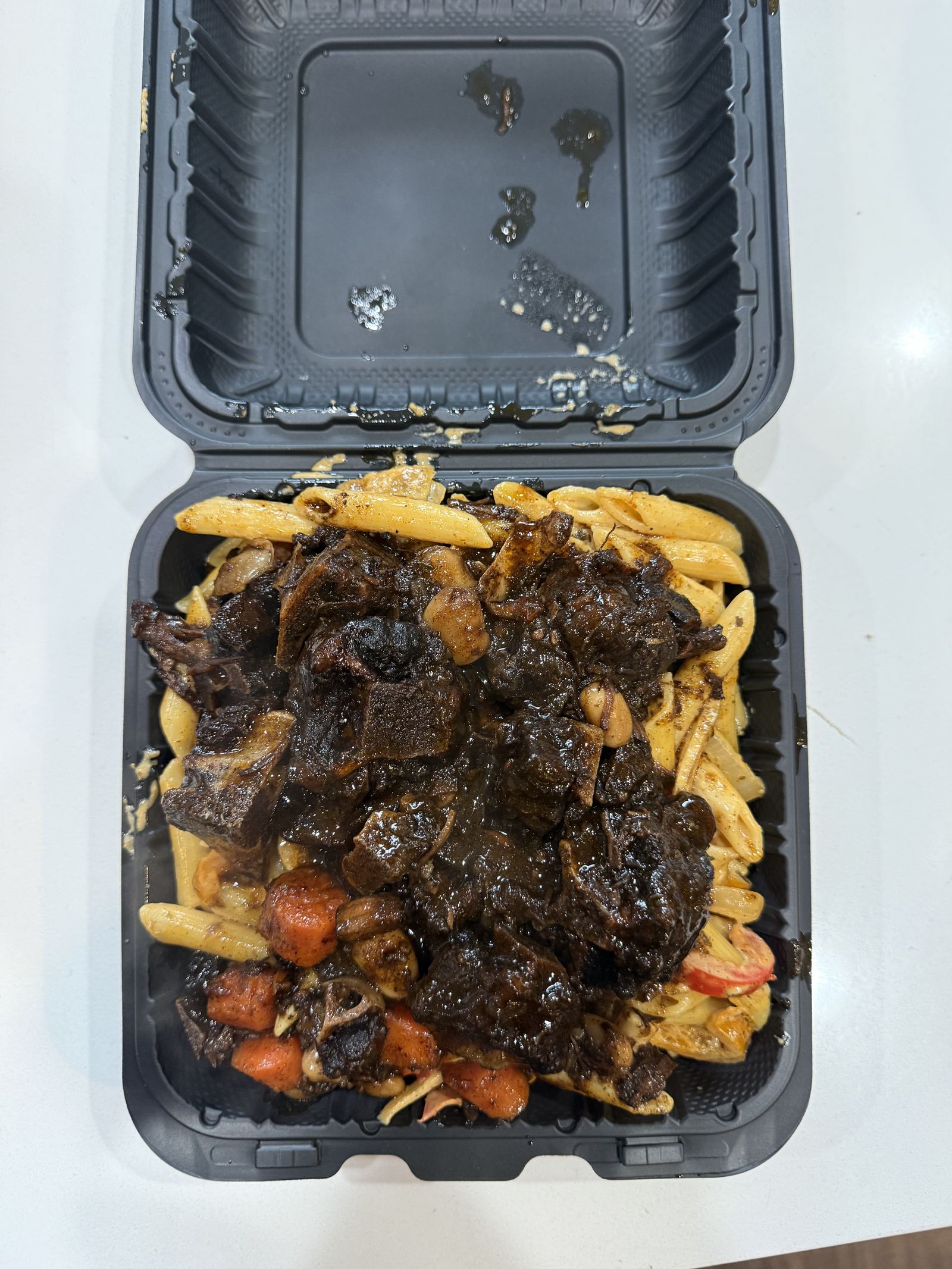 Oxtail over rice and peas