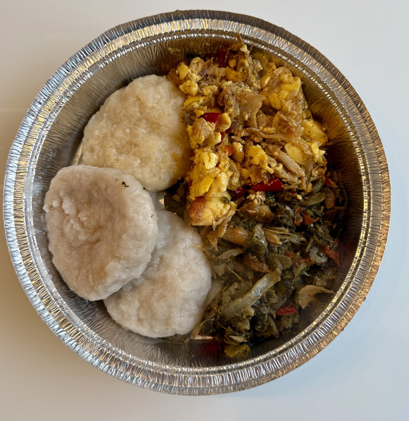 Ackee and saltfish with dumplings and cabbage
