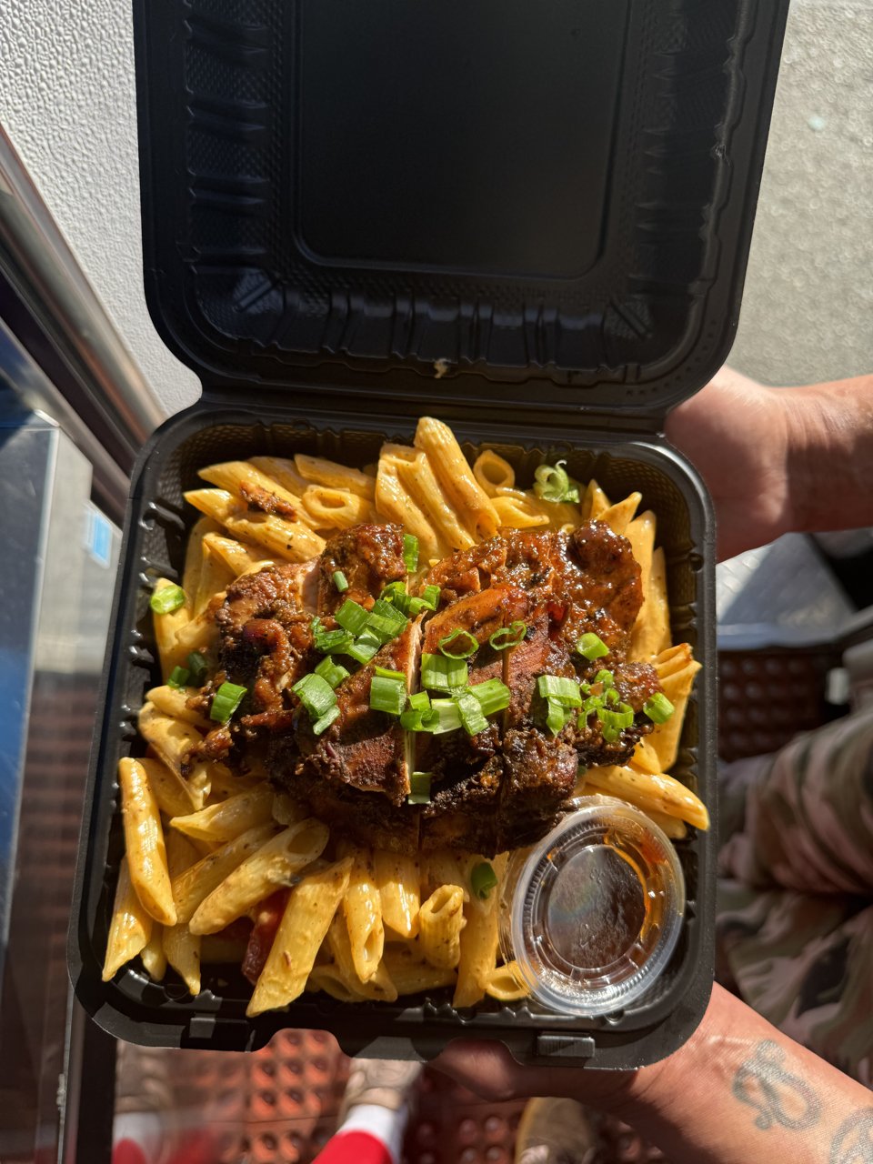 Rasta pasta with jerk chicken to go